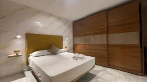 Łóżko lub łóżka w pokoju w obiekcie Apartamento Golf Beach