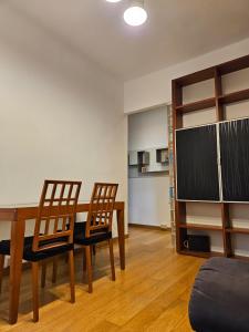 a dining room with a table and two chairs at Alloggio Desiri in Pavia