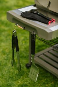 a picnic table with a pair of utensils on it at Cabin Sonka in Oščadnica