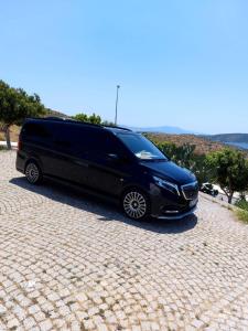 a black van parked on a brick road at AVC Tur in Istanbul