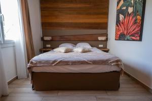 Cama ou camas em um quarto em Hôtel & Restaurant Les Mouettes