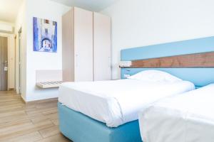 Cama ou camas em um quarto em Hôtel & Restaurant Les Mouettes