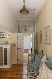 a living room with a couch and a fireplace at Merrion Mews in Dublin +20 photos