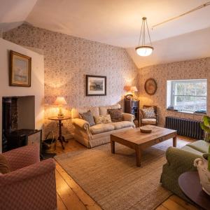 a living room with a couch and a table at Merrion Mews in Dublin