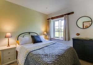 Postel nebo postele na pokoji v ubytování Coldwell Cottage