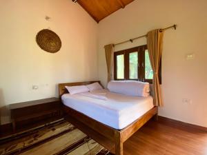 Postel nebo postele na pokoji v ubytování Bardia Eco Friendly Homestay