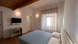 TV a/nebo společenská místnost v ubytování B&B Aurora