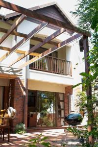 a house with a balcony and a patio at Villa T3 - Selborne Golf Estate in Pennington