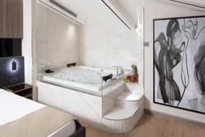 a bathroom with a bath tub in a room at Nish Palace Beşiktaş in Istanbul