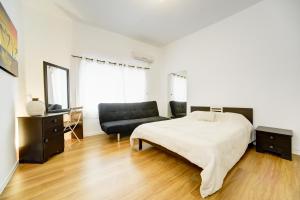Vuode tai vuoteita majoituspaikassa Tel Aviving Exclusive Apartments
