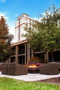 a building with a fire pit in front of it at DoubleTree by Hilton Hotel Orlando at SeaWorld in Orlando