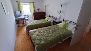 เตียงในห้องที่ Apartment Antares