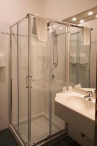 a bathroom with a shower and a sink at Hotel Berta in Desenzano del Garda