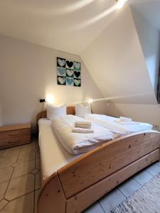 a bedroom with a large bed in a attic at Winterberg Appartement 21103 in Winterberg