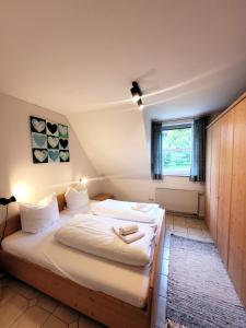 Postel nebo postele na pokoji v ubytování Winterberg Appartement 21103