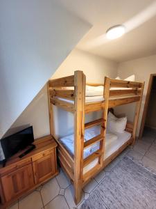 Postel nebo postele na pokoji v ubytování Winterberg Appartement 21103
