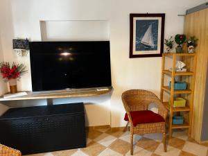 a living room with a large flat screen tv at Darsena Apartments in Savona