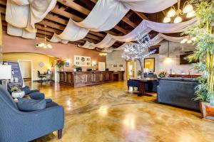 a large room with couches and a ceiling at Comfort Inn Pomona near Fairplex in Pomona