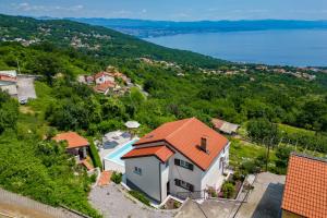 an image of a house with a view of the water at Holiday Home Kvarner in Ičići