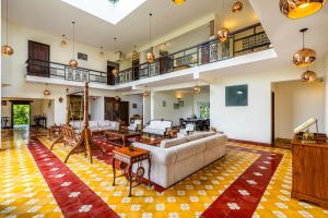 a large living room with a couch and a table at ama Stays & Trails Anjanagiri , Kotagiri in Kotagiri