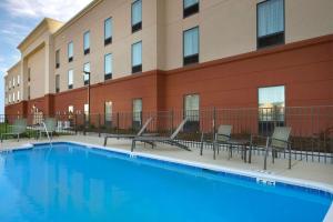 a swimming pool in front of a building at Hampton Inn Kimball in Kimball
