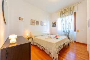 Posteľ alebo postele v izbe v ubytovaní La Rosa Dei Venti Lake View Terrace - Happy Rentals