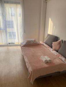 a bedroom with a bed with a stuffed animal on it at Beautiful and lovely apartment in Tirana