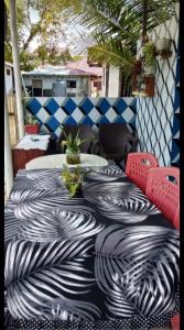 a black and white table with two chairs on a patio at Naca Homestay in Manado