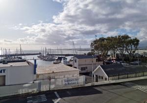 a view of a marina with boats in the water at '11 Gordonia'- 2 En-suite Bedrooms, Beach access & Great location in Cape Town