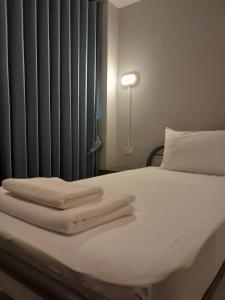 Una cama o camas en una habitación de Stay Wanglang