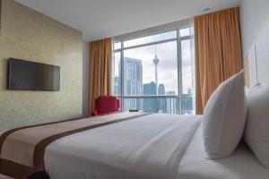 Postel nebo postele na pokoji v ubytování Tamu Hotel & Suites Kuala Lumpur
