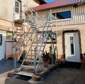 a metal staircase in front of a house at Gödelsteinhof in Contwig