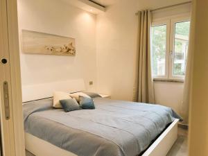 Posteľ alebo postele v izbe v ubytovaní Casa vacanze Sardegna B