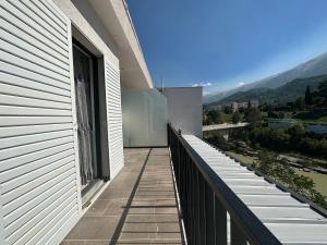 a balcony of a house with a view of the mountains at Hotel Trifoni in Përmet