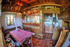 an overhead view of a kitchen with a table at Na Skaluc - Country estate & Glamping in Trobni Dol