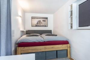 a bedroom with a bed with a wooden frame at Ferienwohnung am Parksee in Bad Bodenteich