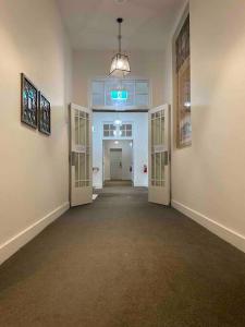 an empty hallway with two doors and a hallway with at New York on Moorabool - Free Wi-Fi in Geelong