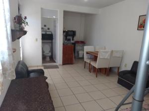a kitchen and dining room with a table and chairs at Sweet Home in Tequisquiapan