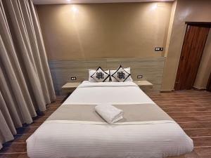 Una cama o camas en una habitación de Pokhara Backpackers Hostel