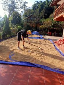 a person is playing in the sand with a racket at Lee's Charm Homestay in Sa Pa