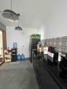 a kitchen with a black counter top in a room at Newly refurbished flat,Marble floors.Central Cairo in Cairo