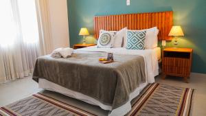 Un pat sau paturi într-o cameră la Pouso da Rita - Tiradentes