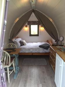 a bedroom with a bed in a tent at Wharfe Camp Adults Only Glamping Pod in Kettlewell