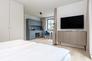 TV a/nebo společenská místnost v ubytování Gustav Appartements