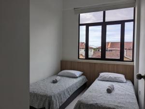 Llit o llits en una habitació de Alor Setar Imperio by IM Staycation 3bedroom & Rooftop Pool