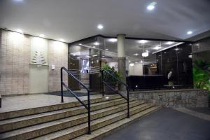 a set of stairs leading up to a building at Cedro Hotel in Londrina