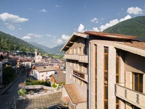 a view of a city from a building at Hotel Vezza Alpine Lodge & Spa in Vezza dʼOglio
