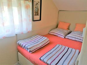 two pillows sitting on a bed in a room at Oázis Vendégház in Gyula