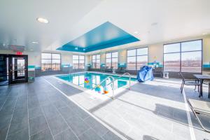 a large swimming pool in a large building at Hampton Inn By Hilton Wichita Northwest in Wichita