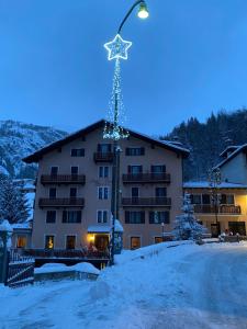 a building with a christmas star on a street light at Centrale in Courmayeur